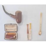 Two 9ct gold mounted cheroot holders, other cheroot holders, a pipe and other items