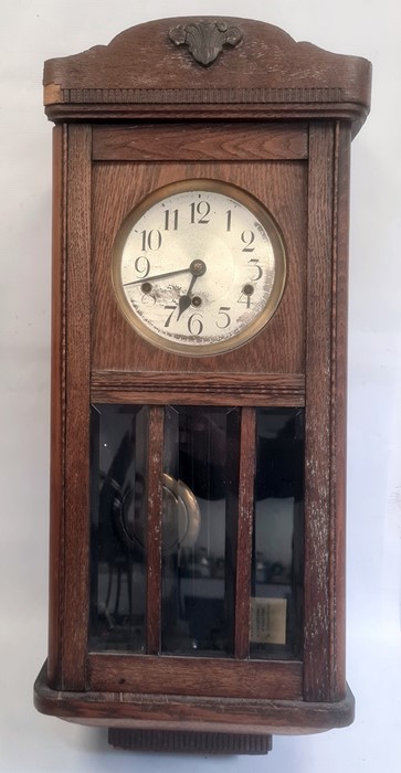 20th century oak wall clock with Arabic numerals to the dial, oak case