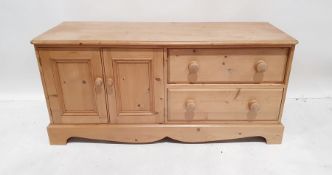 20th century low pine unit, the rectangular top with moulded edge, rounded front corners, to the