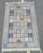 Modern silk rug, the central field split into panels with various decorations, panelled border,