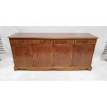 Modern yew sideboard with four drawers, four cupboard doors, on bracket feet, 181cm x 81cm