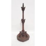 Anglo Indian style 20th century standard lamp in Eastern hardwood, the column carved with various