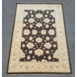 Modern Afghan Ziegler style black ground rug with cream ground foliate decoration to the field,