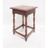 Oak side table, the square top with moulded edge, on turned and block supports, stretchered base,