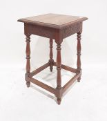 Oak side table, the square top with moulded edge, on turned and block supports, stretchered base,