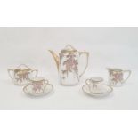 Japanese porcelain tete-a-tete coffee service, wisteria decorated in pink and gold, viz:- coffee