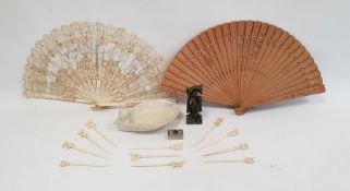 Bone cocktail sticks, Eastern carved stone figure, wooden brise fan, lace and bone fan and a