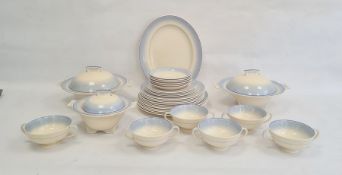 Mid 20th century Royal Doulton pottery part dinner service, cream with banded blue borders,