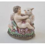 19th century French porcelain figural bonbonniere in Chelsea style modelled with cupid and a