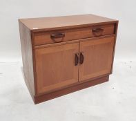 Low G-Plan teak unit, the rectangular top above single drawer, pair of cupboard doors, on plinth