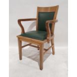 20th century oak armchair with green vinyl seat and back, on square section legs, tapering supports