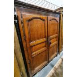 19th century French armoire, the moulded cornice above two panelled doors enclosing hanging space