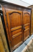 19th century French armoire, the moulded cornice above two panelled doors enclosing hanging space