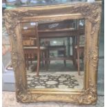 20th century rectangular mirror in moulded gold-coloured frame, 79cm x 68cm