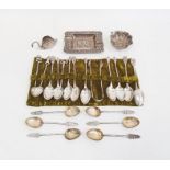 A set of Asian silver coloured metal teaspoons and sugar nips, with monkey, elephant  and animal
