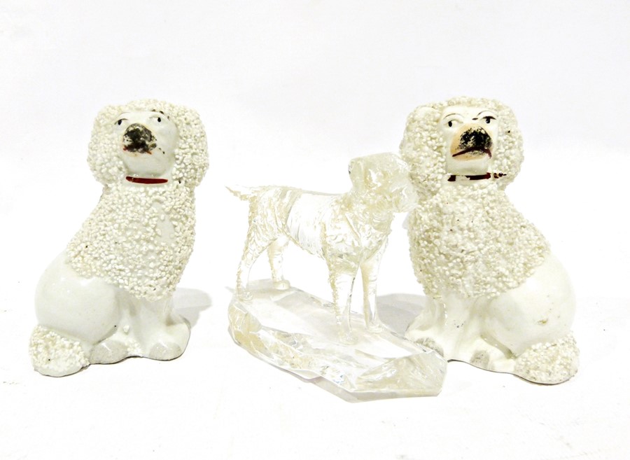 Pair of Staffordshire pottery dogs, 9cm high and a glass model of a dog inscribed New Harris