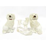 Pair of Staffordshire pottery dogs, 9cm high and a glass model of a dog inscribed New Harris