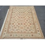 Large modern cream ground rug, the central field with repeating pattern, 367cm x 286cm