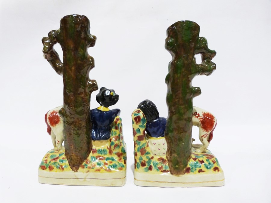 Pair of reproduction Staffordshire vases, the bases of each modelled with a seated figure surrounded - Image 2 of 2