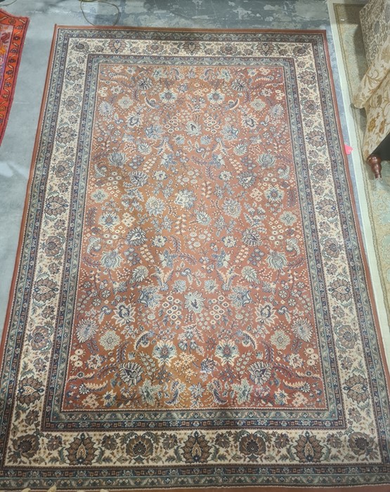 Modern peach ground rug, allover foliate decoration, cream border, 292cm x 200cm