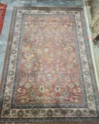 Modern peach ground rug, allover foliate decoration, cream border, 292cm x 200cm