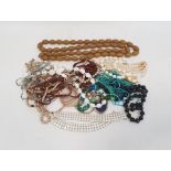 Quantity of costume jewellery including long string of bakelite beads, carved bone beads,
