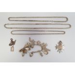 Silver-coloured curb link bracelet hung with charms, a silver plated fob, a silver-coloured