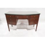 20th century bowfront dressing table of seven assorted drawers, on square section fluted tapering