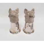 A pair of silver coloured metal fox head stirrup cups, 12cm approx. (2)