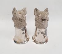 A pair of silver coloured metal fox head stirrup cups, 12cm approx. (2)