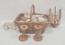 Quantity of weaving implements and wool in small wicker basket