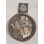 Assorted world coins in a leather case