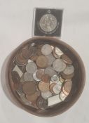 Assorted world coins in a leather case