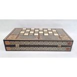 Parquetry inlaid chequerboard games box, hinged with various playing pieces, 51cm wide