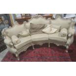 Modern French-style beige painted and upholstered curved three-seat sofa and cushions Condition
