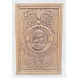 Renaissance style carved oak panel with male bust in high relief to centre, scrolls and foliage
