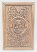 Renaissance style carved oak panel with male bust in high relief to centre, scrolls and foliage