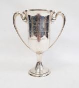 An early 20th century sterling silver two-handled trophy cup, inscribed 'Lt. Col. George W. Gatchell