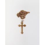 9ct gold small crucifix pendant and the gold-coloured metal chain