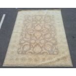 Large fawn ground rug with allover floral decoration, cream borders, 306cm x 242cm