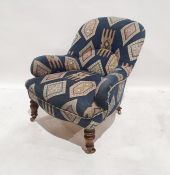Late 19th/early 20th century armchair by Howard & Sons, reupholstered in blue ground patterned