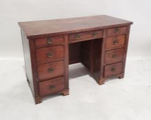 20th century desk of nine drawers, on bracket feet, 118cm wide