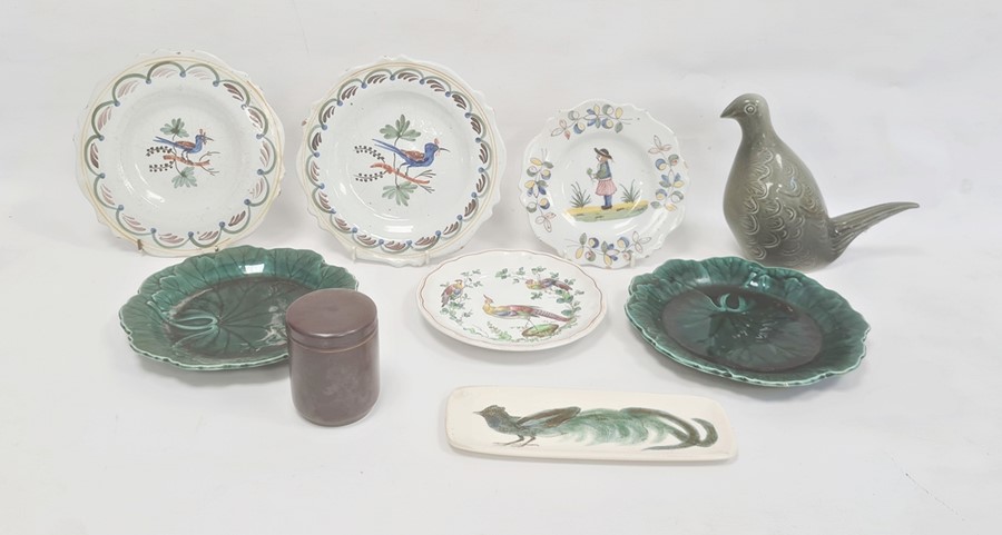 Quimper-style faience plate with figure to centre, another pair, bird decorated, two green leaf