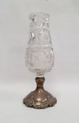 A sterling silver and cut glass pedestal vase, the cut glass vase to a sterling silver base with