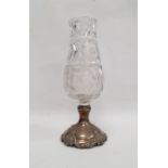 A sterling silver and cut glass pedestal vase, the cut glass vase to a sterling silver base with