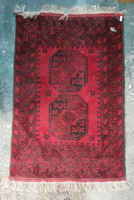 Modern Eastern-style rug, red ground, black decoration, 122cm x 80cm