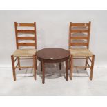 20th century mahogany circular coffee table and two pine ladderback chairs (3)