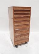 20th century office nest of shallow drawers on castors in the Cotswold School taste, 33 x 76.5cm x