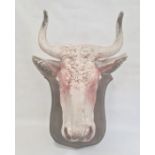 Painted polystyrene model of a cow's head, mounted on painted wood shield, 53cm high overall