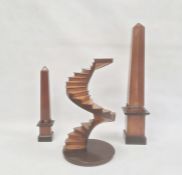 Architectural wooden model of spiral staircase, 36.5cm high and two various wooden obelisksCondition